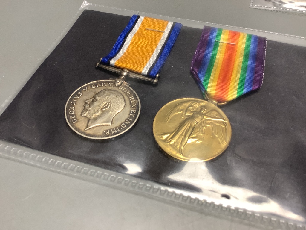 A collection of WW1 medal pairs